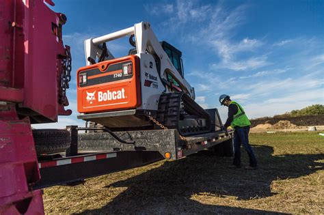 how to load a skid steer in a box truck|bobcat dump truck positioning instructions.